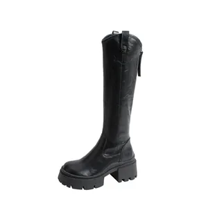 Stylish black knee-high knight boots featuring a thick lug sole and sturdy block heel