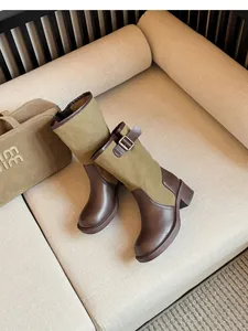 Side view of retro spliced cowboy boots with olive canvas and brown leather