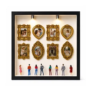 DIY mini museum shadow box with ornate gold frames and miniature figurines