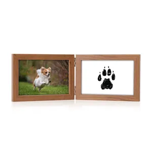 Rustic wooden double hinged pet memorial photo frame showing a dog and a paw print