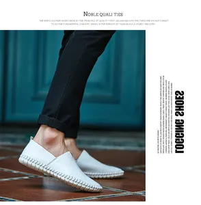 Side detail view of white cowhide leather loafers featuring hand-stitched sole design