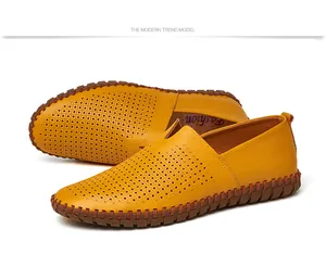 Detailed view of yellow perforated leather men's slip-on loafers with durable stitching
