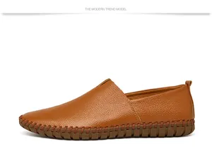 Side profile of brown grain leather slip-on loafers for men with hand-stitched sole detail