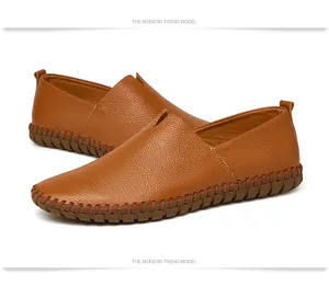 Close-up detail of brown pebbled leather loafers for men with hand-stitched sole texture