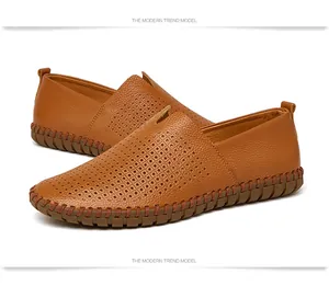 Detail view of men's brown slip-on leather loafers with stylish perforated upper