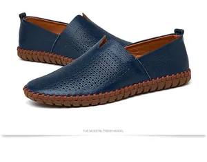 Detailed side view of navy blue genuine leather slip-on loafers with perforated breathable design