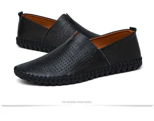 Close-up view of black genuine leather loafers featuring a perforated breathable design