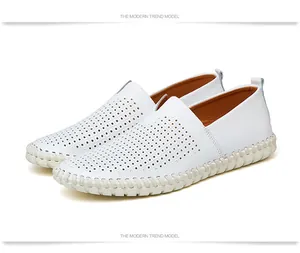 Detailed view of white perforated leather texture on men's casual slip-on loafers.