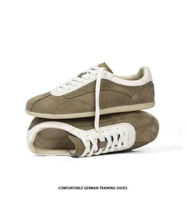 Vintage olive green suede German training shoes for men with premium white leather details
