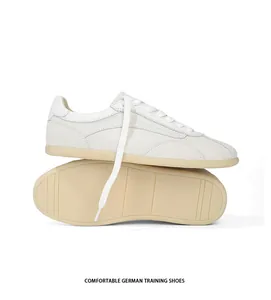Classic white German training shoes with suede panels and gum rubber sole detail view