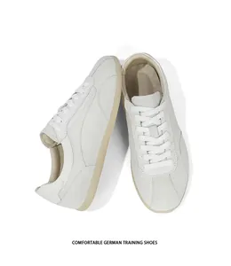 Detailed view of minimalist off-white suede German training shoes for men in retro style