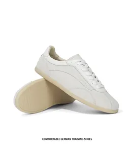 Close-up detail of retro suede German training shoes in cream white