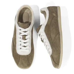 Vintage men's suede sneakers with white leather trim and classic thin gum sole