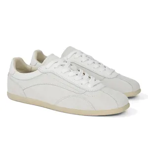 Minimalist vintage suede sneakers in off-white leather with thin gum sole, old money style.