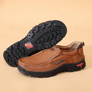 Detail view of brown men's leather loafers showing side profile and anti-slip rubber outsole