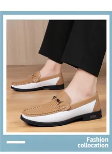 Side view of men's brown and white perforated leather loafers on a model