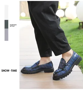 Stylish men's blue plaid double monk strap loafers with thick black lug soles detail