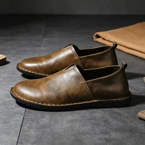 Retro handmade leather slip-on loafers with side hollow design and soft rubber sole