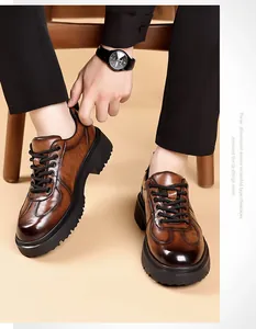 Close-up of men's thick-soled brown leather Derby shoes with crocodile pattern