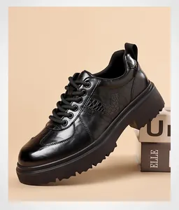 Detailed view of men's black leather platform derby shoe with crocodile texture.