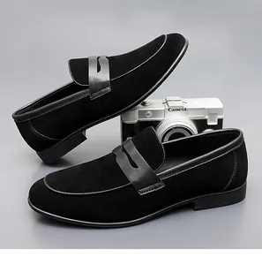 Close-up of black suede material and leather strap detail on elegant men loafers