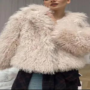 Detailed view of the soft shaggy faux fur texture on this women's winter coat fashion piece