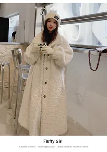 Model wearing a long white thickened plush coat with buttons in a stylish cafe setting