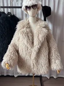 Detail of cream faux fur coat with oversized blazer collar and long fluffy texture.