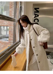 Elegant long white faux shearling coat for women featuring a cozy stand collar detail