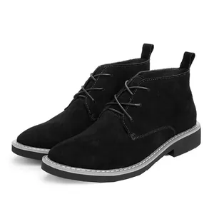 Fashionable men's black suede lace-up chukka boots with stylish pointed toe and grey stitching