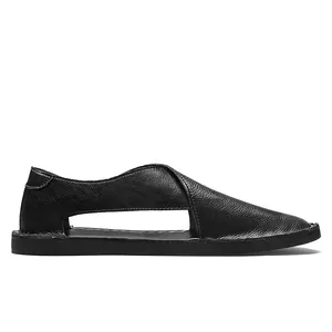 Side profile of vintage black leather slip-on sandals with side hollow design