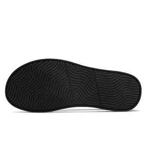 Detailed macro view of the black wavy anti-slip rubber sole for casual summer shoes.