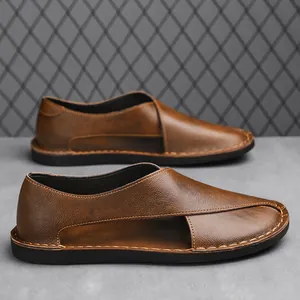 Detail view of brown retro casual loafers with side-hollow design and contrast stitching