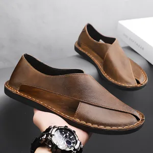 Close-up of retro brown leather loafers with side cutouts and hand-stitched seam.