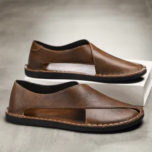Detailed close-up view of brown retro handmade leather sandals with side cut-out design