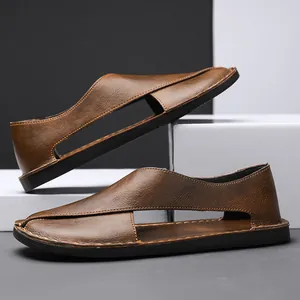 Detailed view of handmade brown leather hollow sandals with closed toe design