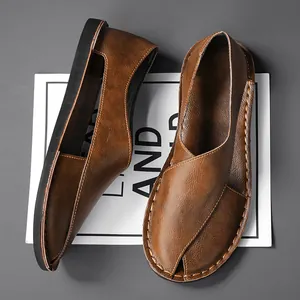 Top view of brown retro hollow leather slip-on shoes with handmade stitching detail