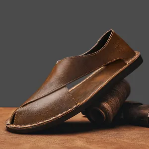 Close-up macro of handmade retro brown leather slip-on sandal with side cutout detail