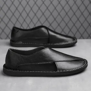 Handmade black leather slip-on loafers with a breathable side hollow design and soft sole