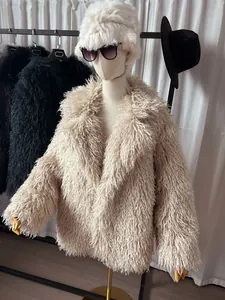 Detailed view of a shaggy beige faux Mongolian lamb fur coat shown on a mannequin