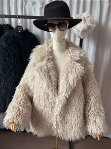 Detail view of shaggy beige faux fur coat with notched lapel on mannequin