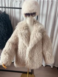 Elegant plush beige faux fur coat with suit collar displayed on a mannequin setup