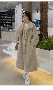 Detailed view of a long beige lamb wool faux fur coat with buttons in a cafe setting.