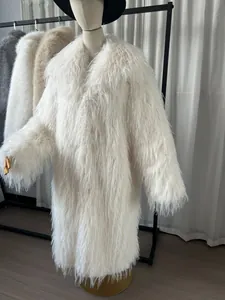 Detailed view of a white long faux fur winter coat showing premium plush texture