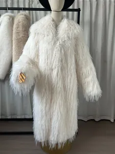 Full view of elegant white shaggy faux fur long coat on mannequin for winter.