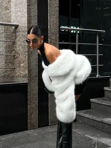 Stylish white faux fur coat for women shown in a modern urban street style setting