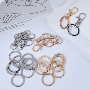 Detail view of gold and silver alloy lobster clasps and key rings for DIY bag accessories