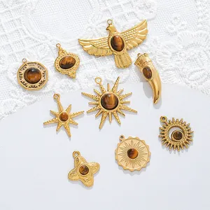 Detailed view of gold plated stainless steel pendants set with natural tiger eye stones.