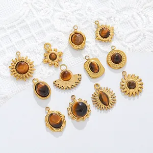 Detailed view of various tiger eye stone stainless steel pendants for DIY jewelry making