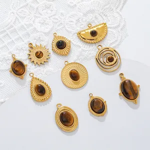 Close-up of golden stainless steel tiger eye stone pendants for DIY necklace making.